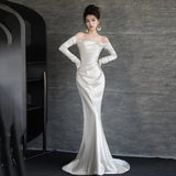 French Light Wedding Dress 2026 New Bride Simple Denswear A Word On The Shoulder White Waist Fishtail Evening Dress HZ0517