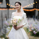Zhang Nora Star Same Wedding Dress 2026 Spring New Linden Collar Simple Long-Sleeved Retro Temperament Main Yarn HZ0517